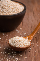 Raw Nature Organic Tapioca pearl or Sago pearls frome Sako palm on wooden table. Thai dessert.