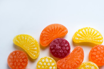 little fruit colored sweet lollipops isolated on white background