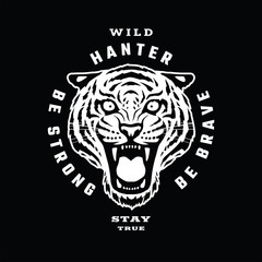 Tiger, wild hunter. Emblem t-shirt design on a dark background.