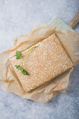 Slice of tempeh  or tempe made of fermentation process that binds soybeans, is traditional food...