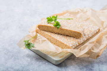 Slice of tempeh  or tempe made of fermentation process that binds soybeans, is traditional food...