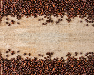 Coffee beans. Isolated on white background. Coffee background. A roasted coffee beans texture background. Coffee beans. Distributed on a wooden background.