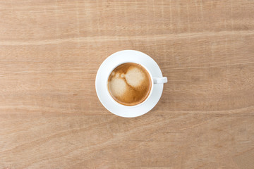 black coffee in a coffee cup top view isolated on wood background. with clipping path.