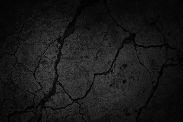 Black grunge background. Texture of cracked concrete wall. Close-up. Background with old dirty...