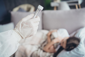 Closeup cropped photo of young sick patient lady lying sofa unwell call ambulance guy doc virologist collected saliva mouth probe flu cold covid test wear gloves protective uniform indoors