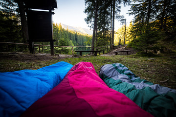 Awakening in the middle of beautiful nature, sleeping bags, point of view