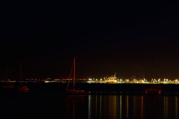 Fototapeta na wymiar View over Auckland harbour at sea port at night