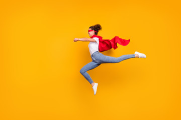 Fototapeta na wymiar Full length body size view of her she nice attractive lovely fit slim cheerful energetic girl jumping wearing cape running rescuing planet isolated bright vivid shine vibrant yellow color background