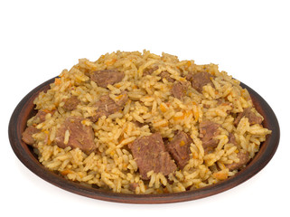 rice pilaf with meat carrot and onion in a plate isolated on a white background