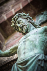 Obraz premium Jesus crucifix sculpture behind the basilica at the village of Sint Odilienberg, Limburg, The Netherlands.