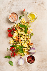 Culinary food cooking background with traditional ingredients for the preparation of Italian pasta. Top view.