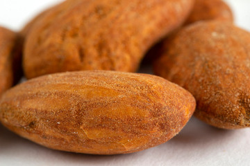A pile of Almonds, isolated on a white background.