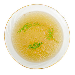 Plate with rich meat transparent broth with dill