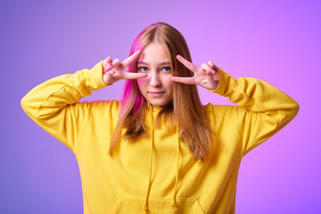 portrait of a beautiful girl smiling in colorful bright clothes in a photo studio