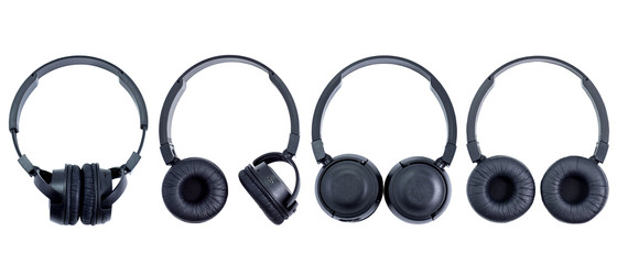 Four black wireless headphones on white background
