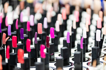 Fototapeta premium Nail polish samples on desk in beauty store