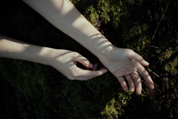 woman hand or hands in nature