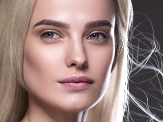 Natural make up blond hair woman close up face beauty portrait