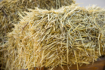 Haystack that lies in a cart. Hay texture.