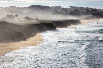 Morning fog over Montara State Beach. View of the Pacific Ocean, traveling south on the Pacific Coast Highway, California