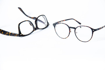 Two pair of vintage or classic style eye glasses isolated on white background, copy space.