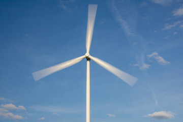 Wind turbine against a blue sky