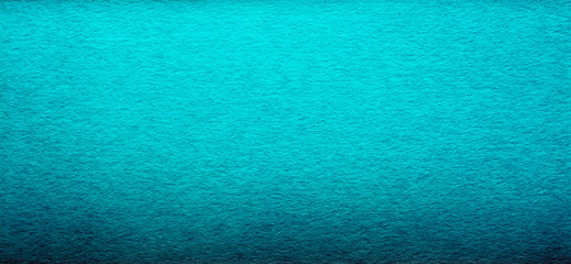 Good quality porous grunge blue color cardboard paper texture close-up with vignette dimming on the sides.