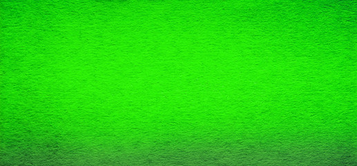 Good quality porous green color cardboard paper texture close-up.