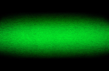 Good quality porous grunge green color cardboard paper texture close-up with vignette dimming on the sides.