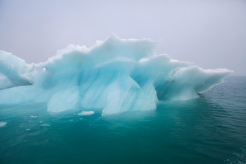 Icebergs floating. Ices and volcanic ash. Glacier lagoon. Melting ice. South coast Iceland.Volcanic...