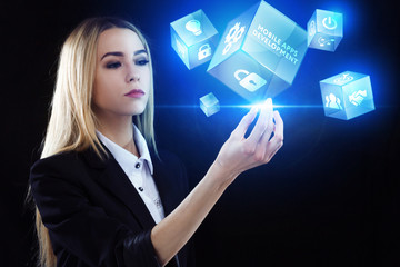 Business, Technology, Internet and network concept. Young businessman working on a virtual screen of the future and sees the inscription: Mobile apps development