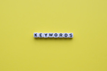 Keywords word on yellow background.