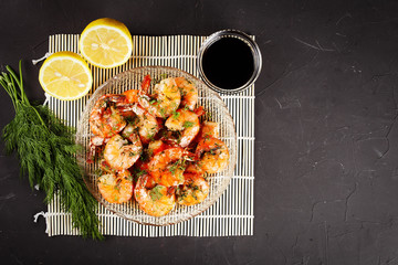 fried king prawns in a plate on a bamboo mat, lemon, dill, place for menu text