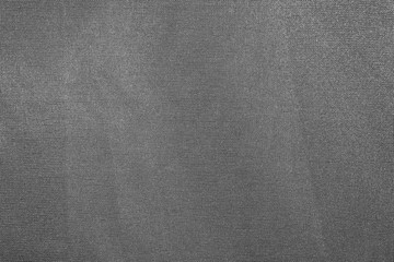 Fototapeta na wymiar Grey crumpled abstract fabric texture as background