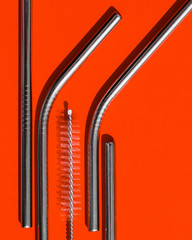 A set of reusable cocktail tubes and cleaning brushes. The concept of reducing waste. The view from the top
