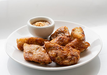 Fried radish rolls, Dim Sum made from Chinese radishes dried shrimp, shiitake mushroom and peanuts rolled with tofu sheets