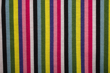 Multicolored striped fabric texture as background