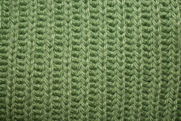Green woolen texture as background