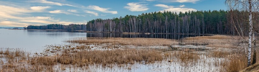 panoramic autumn landscape with lake on front