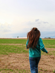 young woman standing on the field