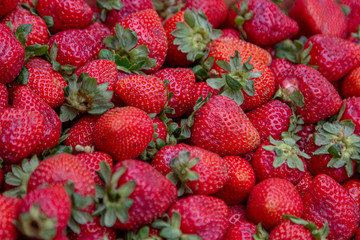 
strawberries for sale in a public market
