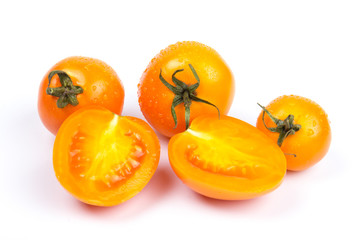 Yellow fresh tomatoes  isolated on white background in close-up