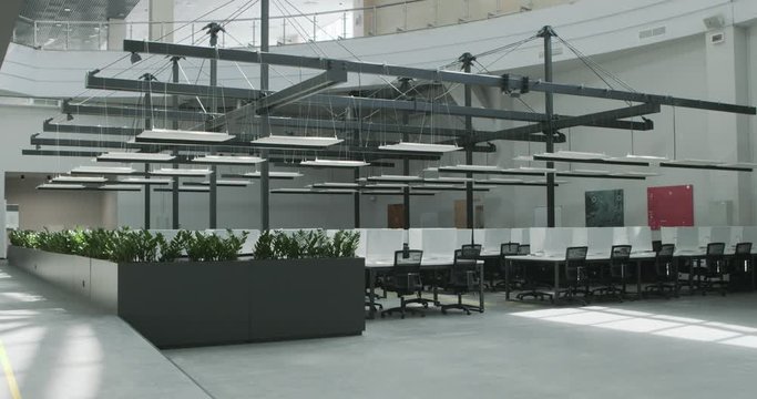 Modern workplace with conference zone and covered computers