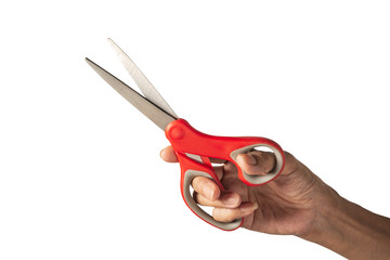 Hand holding a scissors with red plastic handle and clipping path isolated on a white background.