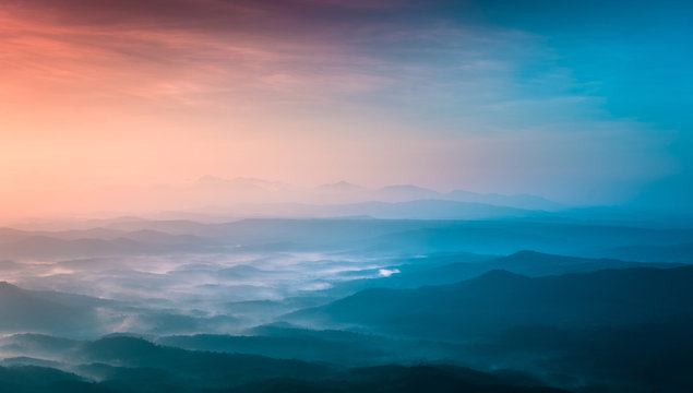 breathtaking nature view colorful sunset with foggy weather, Kerala Travel and Tourism Concept image Misty mountain sunset scenery