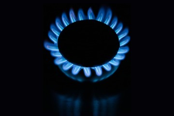 Stove circular blue flame on a black background