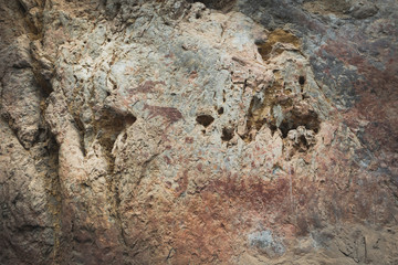 Ancient paintings painted by prehistoric people on the cliffs showing various stories of that era.