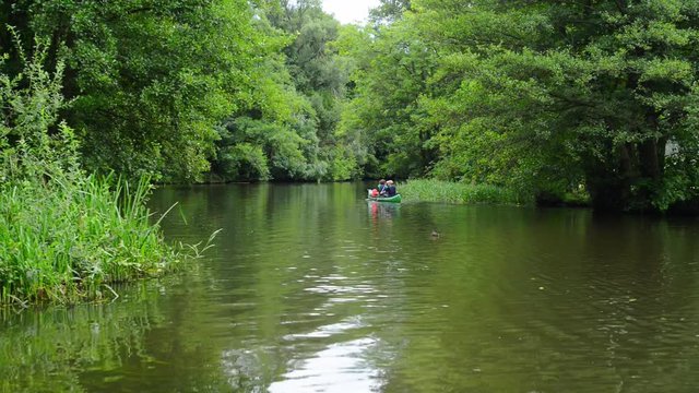 Canoes with tourists on a river in Luebben Germany - L&uuml;bben, Spreewald Kanus und Fliess