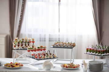 Table with sweets, buffet with cupcakes, candies. Candy bar, a table with sweets and desserts....