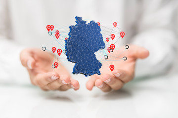 Abstract of germany map network in hand